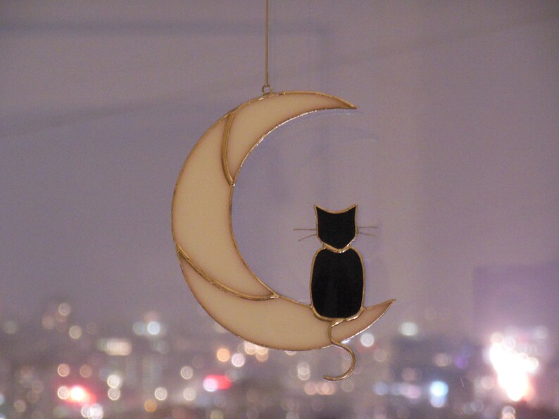 Hanging Suncatcher Black Cat On Moon stained glass window is a unique handmade decor, idea for anniversary, birthday and Christmas gift for an animal lover. This cute miniature art can decorate your home and garden outdoor decor, pet loss memorial.