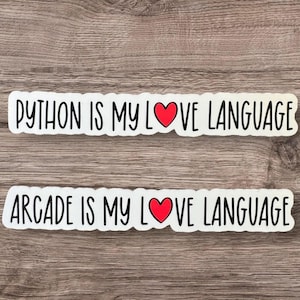 May include: Two white stickers with black text and a red heart. The top sticker says "PYTHON IS MY LOVE LANGUAGE". The bottom sticker says "ARCADE IS MY LOVE LANGUAGE".