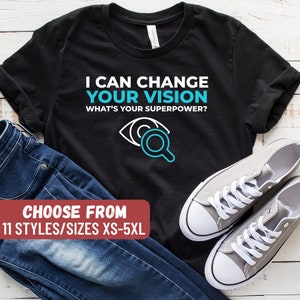面白い検眼医Tシャツ、眼鏡店ギフト、眼科医Tシャツ、検眼Tシャツ、「あなたの視力を変えられます。あなたのスーパーパワーは何ですか？」Tシャツ