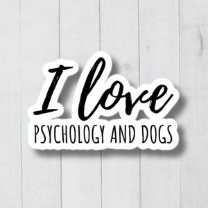 Könnte beinhalten: Weißer Aufkleber mit schwarzem Text, der "Ich liebe Psychologie und Hunde" lautet.