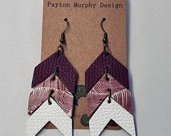 May include: Purple, pink, and white layered arrow earrings with a gold hook. The earrings are on a brown card with the text "Payton Murphy Design".