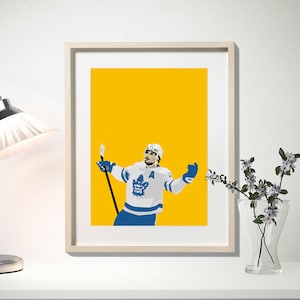 Wall Art: Auston Matthews, ORANGE - 56th Goal Celly (OT Winner - April 7, 2022) Print at home
