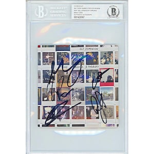 May include: A signed CD booklet for the album "Time Tequila & Therapy" by Old Dominion. The booklet features a collage of photos in a Polaroid style. The band's signatures are in black ink.