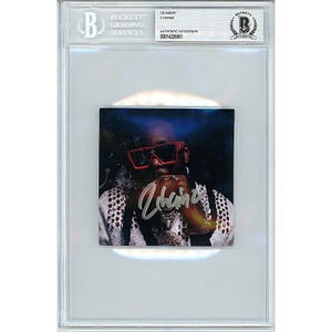 May include: A red and black CD insert featuring a photo of 2 Chainz wearing red sunglasses and a white shirt with a silver chain. The insert is signed "2 Chainz" in silver ink.