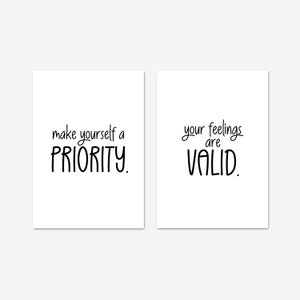 May include: Two white cards with black text. The first card says "make yourself a priority." The second card says "your feelings are valid."