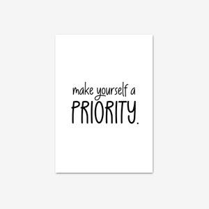 May include: A white rectangular print featuring the words "make yourself a PRIORITY" in black cursive and block lettering. This print is a motivational piece, ideal for home or office decoration.
