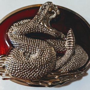 Snake coiled Rattle Snake Belt buckle Blood red Back ground Full Metal Outdoors 3.2" wide x 2.5" tall Fits belts measuring up to 1-1/2" wide