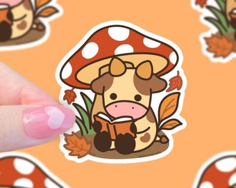 Cozy Autumn Cow Reading Under Mushroom – Fall Cottagecore Sticker, Cute Kawaii Vinyl Cow Sticker, Mushroom Lover Gift