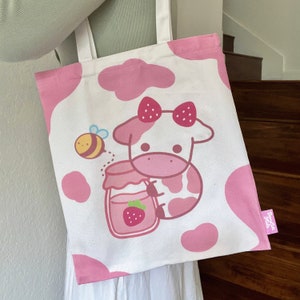 Bolsos de mano de vaca, bolso de mano de vaca de fresa, lindo bolso de lona con estampado de vaca púrpura rosa pastel Kawaii