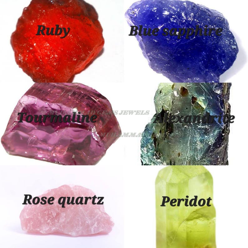 May include: An assortment of rough gemstones, including ruby, blue sapphire, tourmaline, alexandrite, rose quartz, and peridot. Each stone is labeled with its name in a bold, black font. The gemstones display a variety of colors, from red and blue to pink and green.