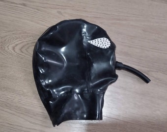 May include: Black rubber mask with a small white eye hole and a black tube attached to the side.