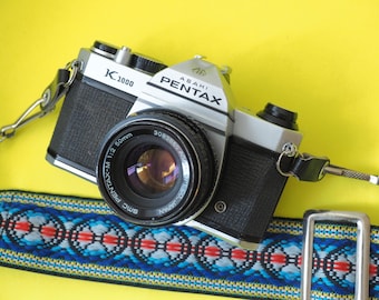 Cámara réflex Pentax K1000 de 35 mm para estudiantes + objetivo de 50 mm FUNCIONA ***PROBLEMAS***
