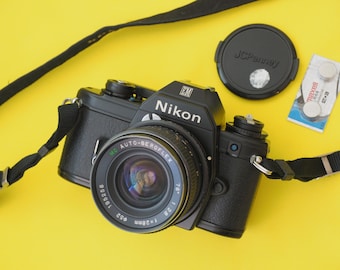 Nikon EM 35mm Film SLR Camera + 28mm Lens + Batteries WORKING