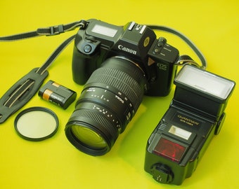 Appareil photo étudiant Canon EOS 650 SLR 35 mm + objectif 70-300 mm + batterie + flash