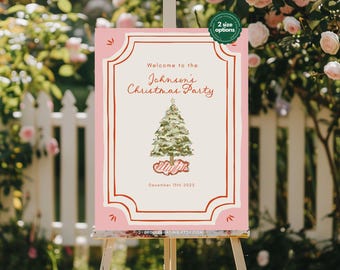 Könnte beinhalten: Ein rosa Weihnachtsparty-Schild auf einer Staffelei. Auf dem Schild steht "Welcome to the Johnson's Christmas Party" mit einer Weihnachtsbaumgrafik und dem Datum 15. Dezember 2025. Ein kleiner grüner Kreis zeigt "2 Größenoptionen" an.