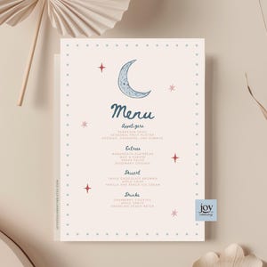 May include: A rectangular menu card on a light beige background featuring a blue crescent moon and red star illustrations. The text includes headings for Appetizers, Entrees, Dessert, and Drinks, with a blue dotted border and the text joycelebrating.etsy.com.