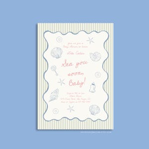 May include: A white and light blue baby shower invitation with a striped background. The invitation features a seashell design and the text "Sea you soon, Baby!"