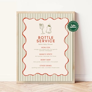May include: A framed sign with a cream background and a red wavy border. The sign reads "Bottle Service" and lists drink options for a baby shower, including Mom-osa and Mama's Spritz. The background has vertical stripes.