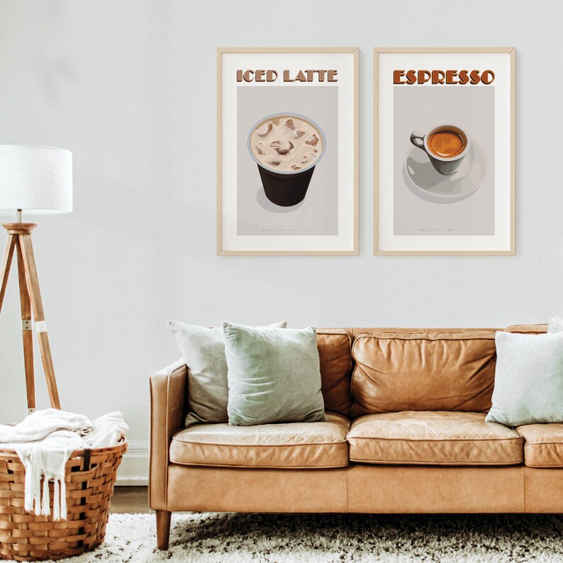 May include: Two framed prints with illustrations of coffee drinks. The left print features a glass of iced latte with the text "ICED LATTE". The right print features a cup of espresso with the text "ESPRESSO".