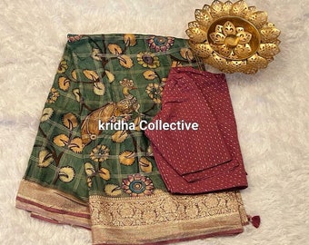 Green shade falling dola silk kalamkari print saree with foil border teamedup with contrast blouse