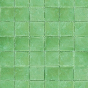 May include: A wall of green square tiles. The tiles are arranged in a grid pattern.