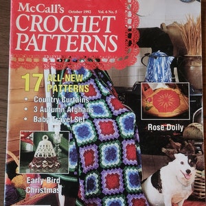 May include: A crochet magazine cover featuring a colourful crocheted blanket, a crocheted doily, a crocheted bell, and a dog. The magazine is titled "McCall's Crochet Patterns" and has the text "17 All-New Patterns" on the cover. The magazine is from October 1992.