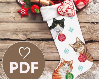 May include: White Christmas stocking with three cats holding ornaments that say "Merry Christmas", "Happy Holidays", and "Best Wishes".