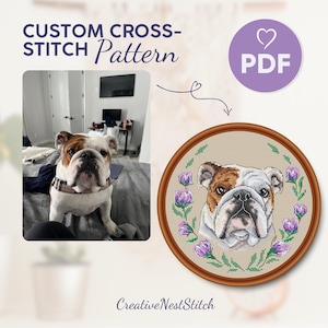 May include: A cross-stitch pattern featuring a bulldog with a brown and white coat, surrounded by purple flowers. The pattern is in a brown wooden frame. The text "CUSTOM CROSS-STITCH Pattern PDF" is at the top of the image.