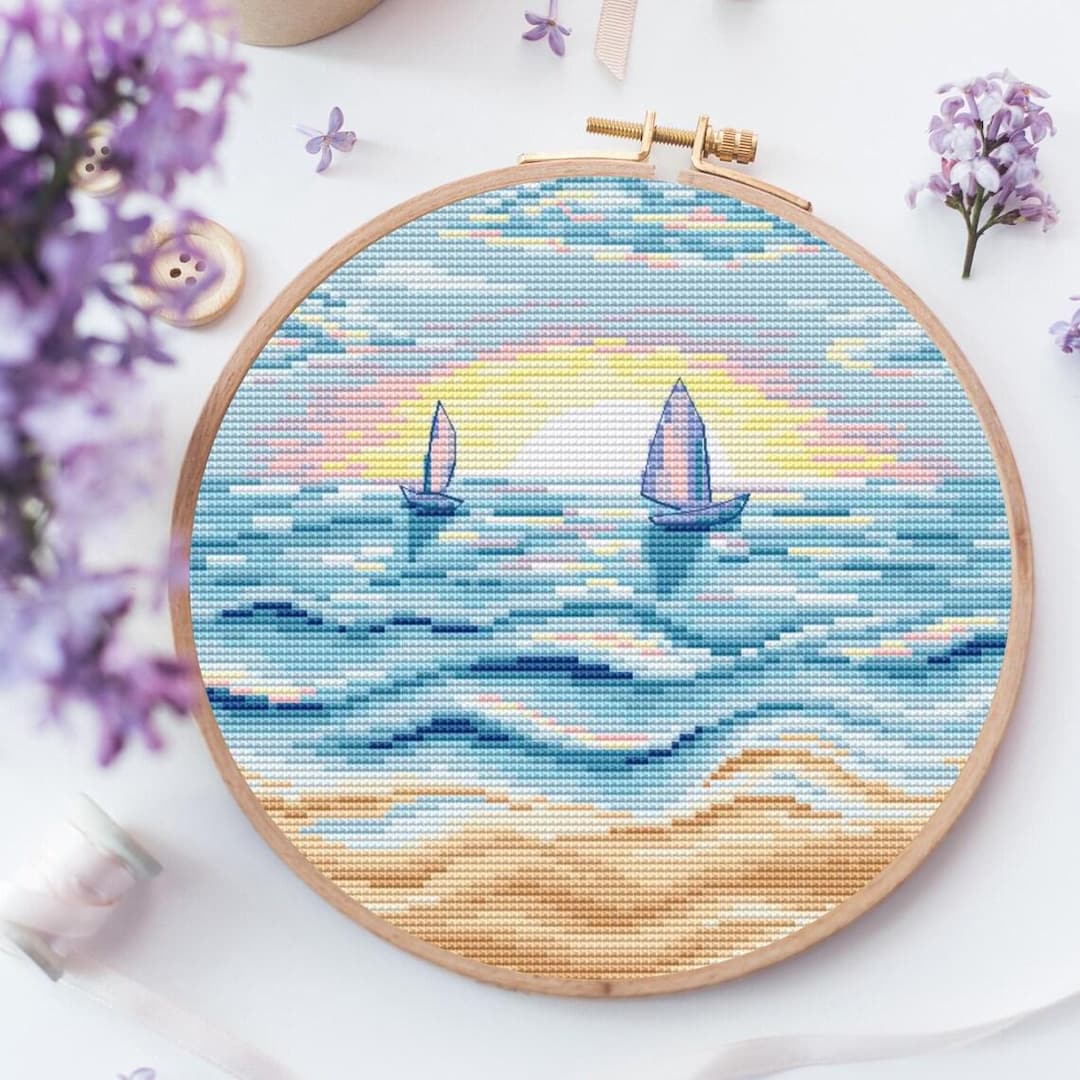 夕暮れ時のセーリングクロスステッチパターン、海の景色の刺繍デザイン
