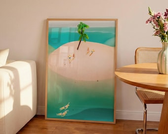 May include: A framed art print showing a tropical island scene. The artwork features a light brown island with a green palm tree, surrounded by turquoise water. Small figures are sunbathing and swimming. The frame is made of light brown wood.