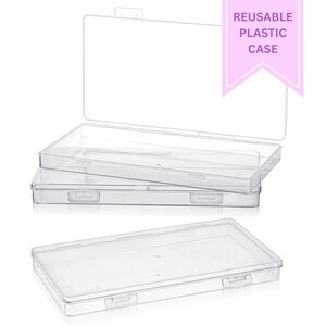 May include: Clear, rectangular plastic cases, one open, stacked on top of each other. The cases have a hinged lid and a clasp closure. The text "REUSABLE PLASTIC CASE" is in a pink banner in the upper right corner.