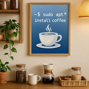 May include: A framed print with a blue background and a white coffee cup illustration. The text reads "~$ sudo apt install coffee". The image is in a wooden frame and hangs above a wooden surface with coffee-related items.