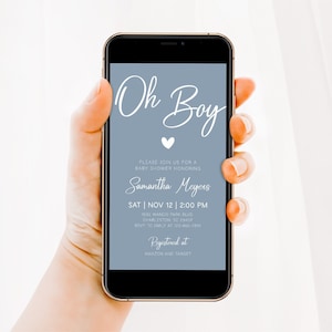 May include: A blue and white baby shower invitation on a smartphone screen. The invitation reads "Oh Boy" with a white heart and says "Please join us for a baby shower honoring Samantha Meyers, Sat | Nov 12 | 2:00 PM, 1502 Wando Park Blvd, Charleston SC 29407, RSVP to Emily at 123-456-7, Registered at Amazon and Target."