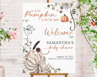 May include: A baby shower welcome sign on an easel. The sign has the text "A Little Pumpkin Is On The Way!" and "Welcome to Samantha's baby shower". The sign is decorated with pumpkins and floral elements.