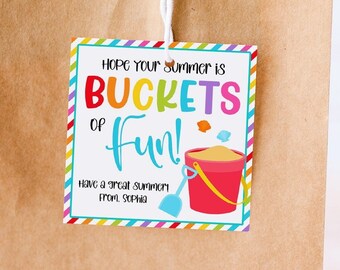 May include: A brown paper gift bag with a colorful tag that says "Hope your summer is BUCKETS of Fun!" with a red bucket and shovel. The tag has a rainbow striped border.