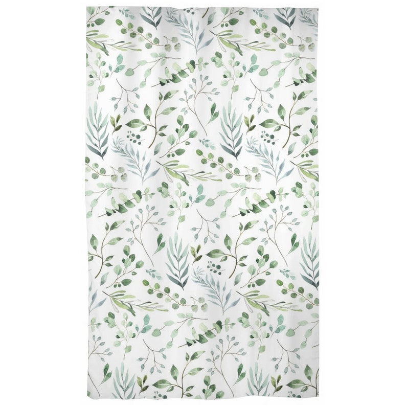 May include: White shower curtain with a watercolor pattern of green and blue-green leaves and branches. The botanical design features various leaf shapes and sizes, creating a natural, organic aesthetic.