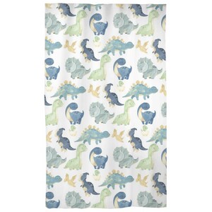 May include: A white shower curtain with a repeating pattern of blue and green dinosaurs. The dinosaurs are in various poses, including walking, standing, and sitting. Some dinosaurs are holding eggs.