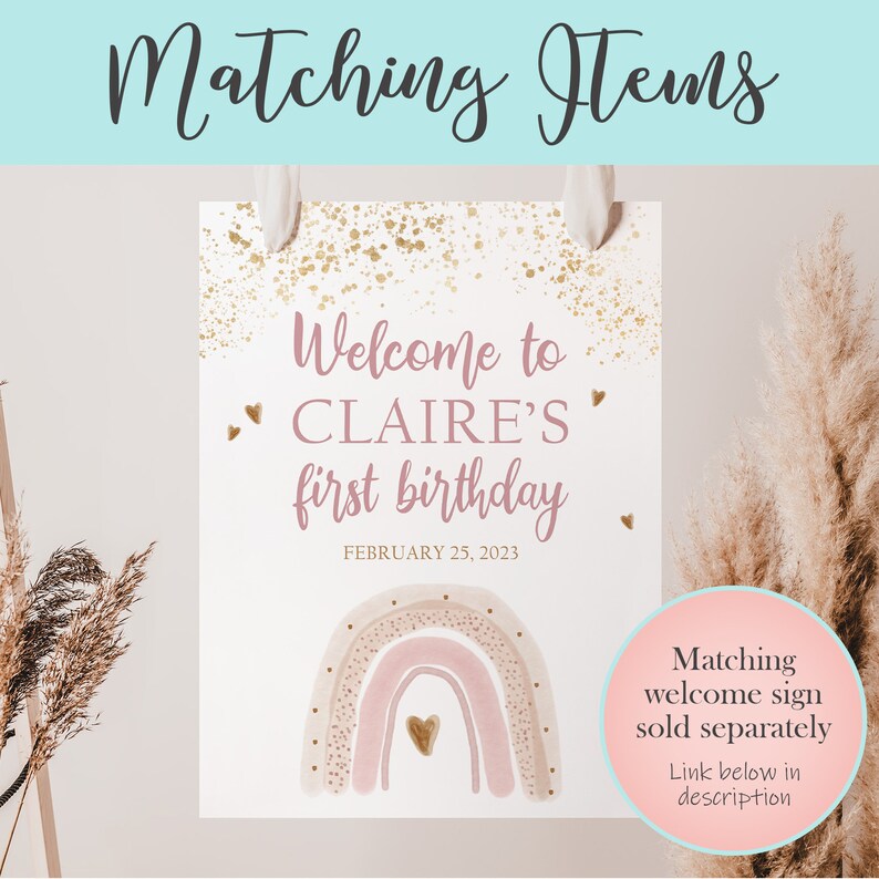 May include: A pink and gold welcome sign with a rainbow and the text "Welcome to Claire's first birthday, February 25, 2023".
