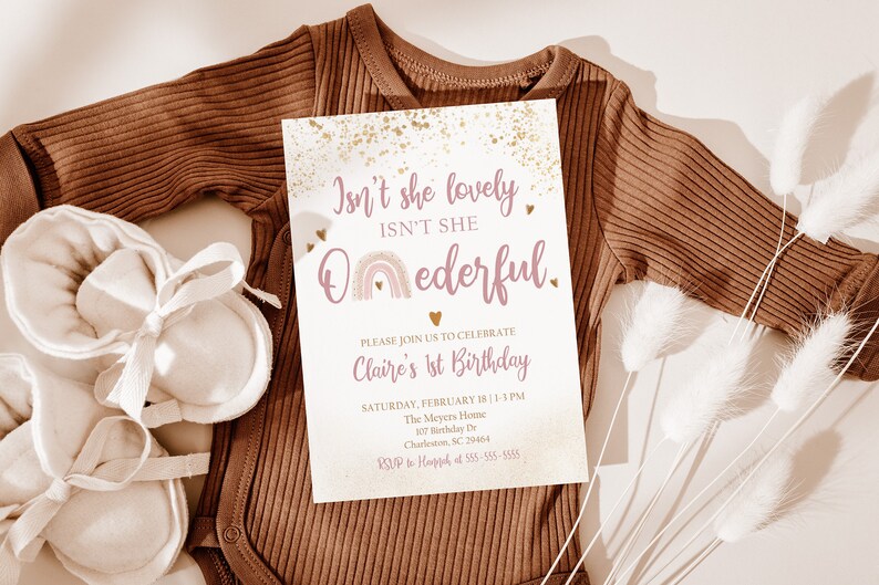 May include: A pink and gold first birthday invitation with a rainbow and the text "Isn't she lovely, Isn't she Oederful." The invitation includes the birthday girl's name, date, time, and location.