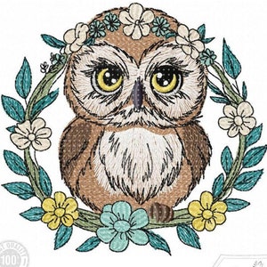 May include: Embroidered design of a brown owl wearing a flower crown. The owl is surrounded by a wreath of green leaves and colourful flowers.