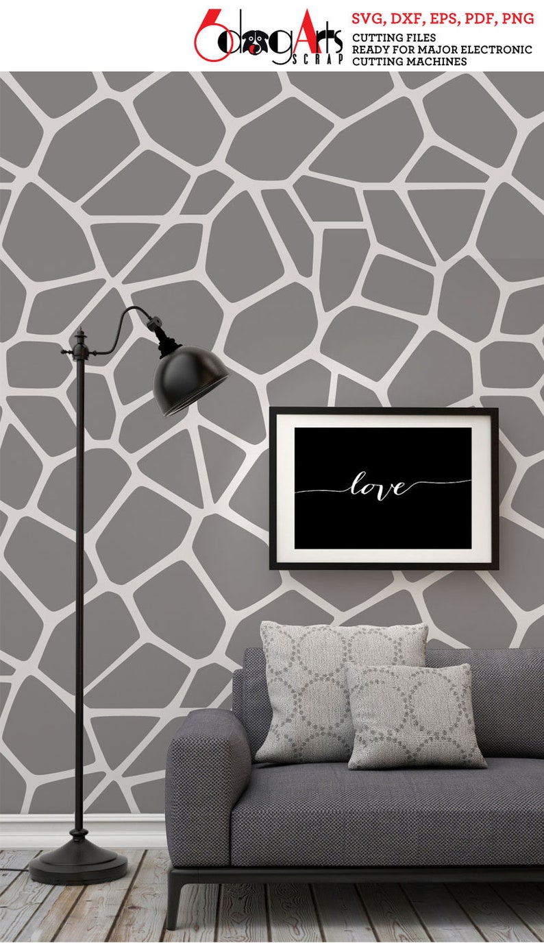 May include: A gray and white geometric pattern wallpaper with a black floor lamp and a black framed picture with the word "love" in white script. A gray couch with two gray patterned throw pillows is in the foreground.
