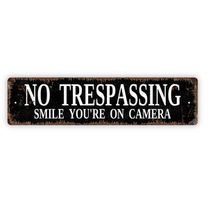 No Trespassing Smile You're On Camera Sign - Rustic Metal Street Sign or Door Name Plate Plaque