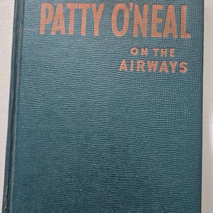 May include: A green hardcover book with the title "PATTY O'NEAL ON THE AIRWAYS" in orange lettering.
