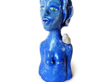Woman sculpture in red or blue clay