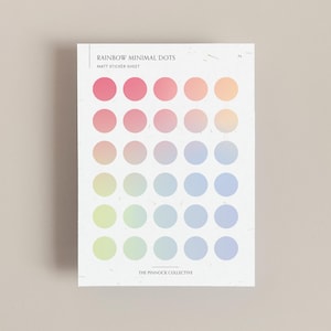 May include: A sheet of rainbow coloured matte sticker dots. The sheet has 36 dots in a 6x6 grid. The dots are arranged in a rainbow gradient from red to orange, yellow, green, blue, and purple.