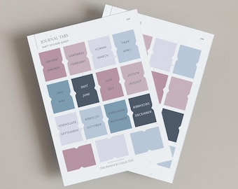 May include: A sheet of matte sticker tabs with the months of the year printed on them. The tabs are in shades of pink, blue, and gray. The text "JOURNAL TABS" and "MATT STICKER SHEET" is printed at the top of the sheet. The text "THE PINNOCK COLLECTIVE" is printed at the bottom of the sheet.