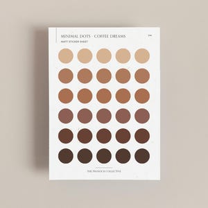 May include: A sheet of matte sticker dots in various shades of brown, from light beige to dark brown. The sticker sheet is titled "Minimal Dots - Coffee Dreams" and "Matt Sticker Sheet". The bottom of the sheet reads "The Pinnock Collective".
