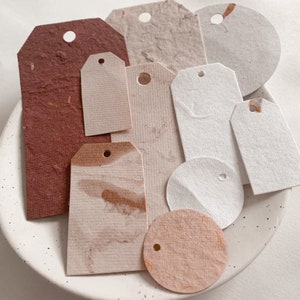 Handmade paper tags, in random sizes, and colours, with minimal cream and red palette, metallic accents, and textured, ephemera tags image 3