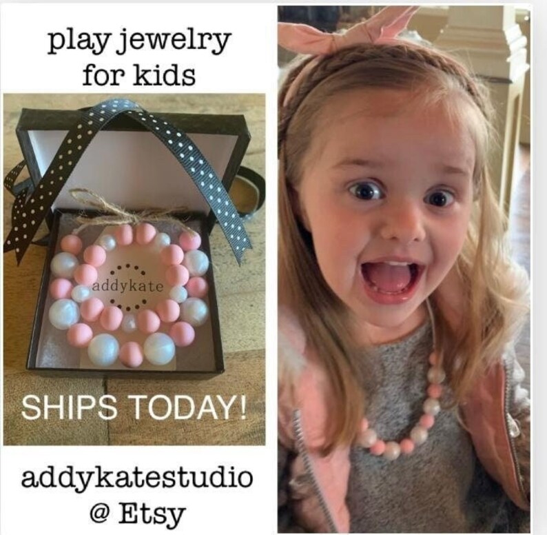 May include: A pink and white beaded necklace and bracelet set for kids. The necklace and bracelet are made of soft, colorful beads. The set is packaged in a black gift box with a white polka dot ribbon.