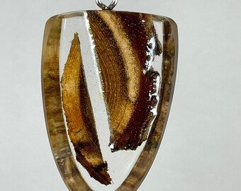 Handcrafted pendant made of acacia wood and epoxy resin